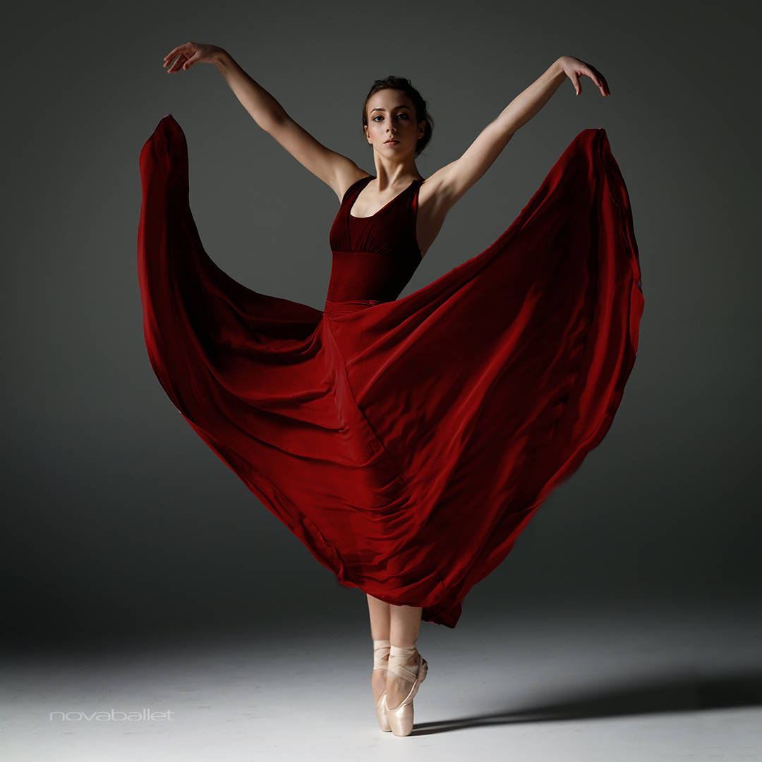 Dance Pose Ballerina In Red Dress Background