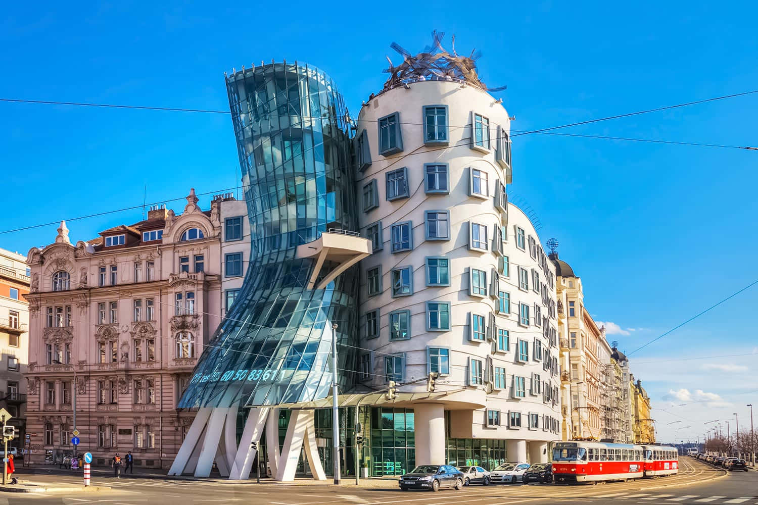 Dancing House With Red Tram Background