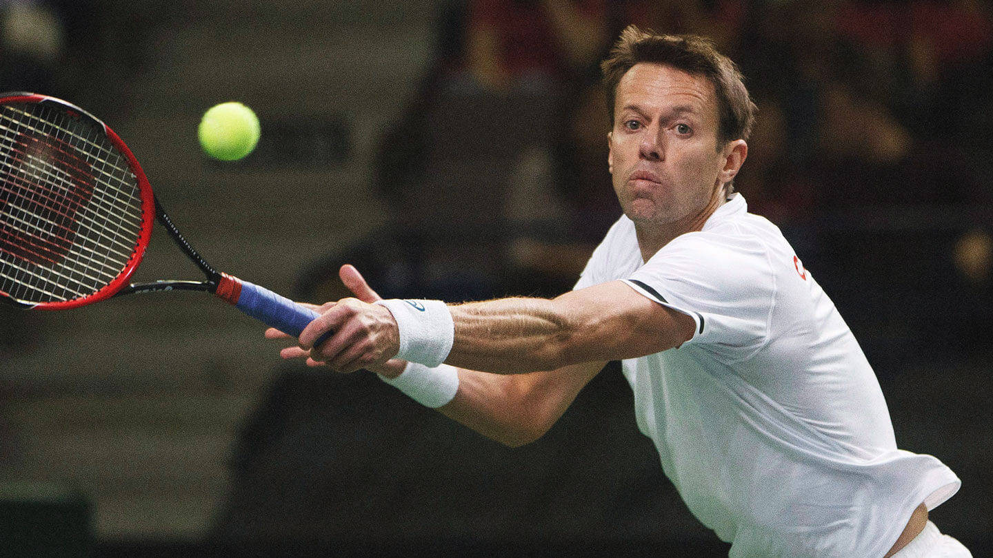 Daniel Nestor Lunging For Ball