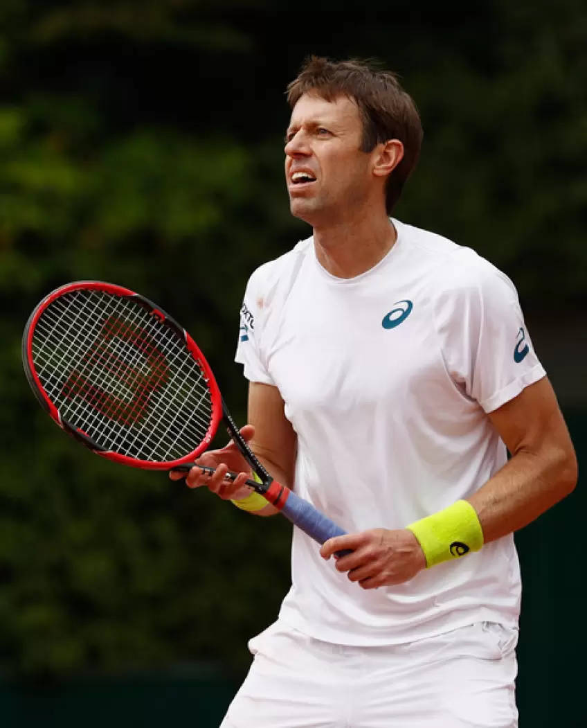 Daniel Nestor Preparing To Return Serve In Game Background