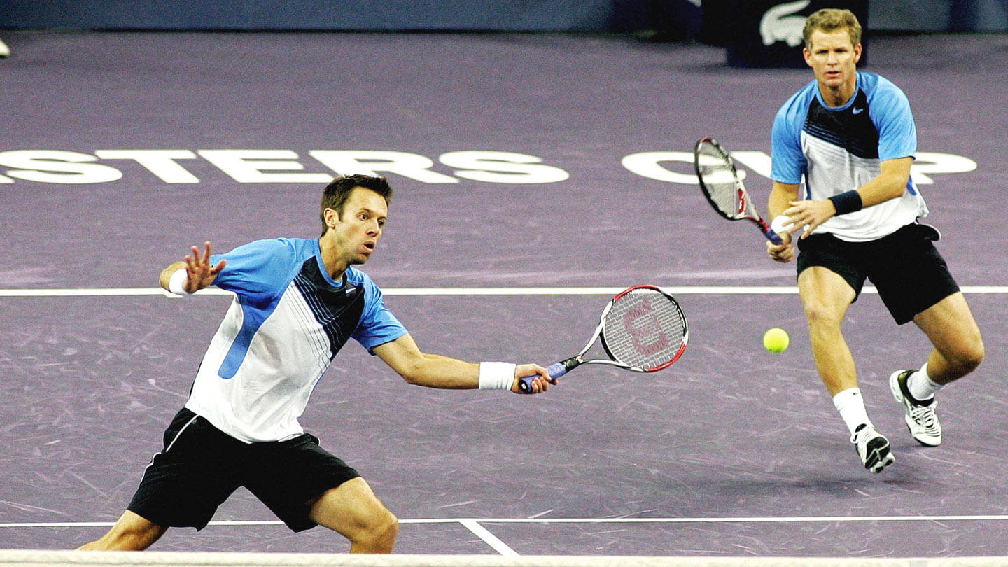 Daniel Nestor Running With Partner Background