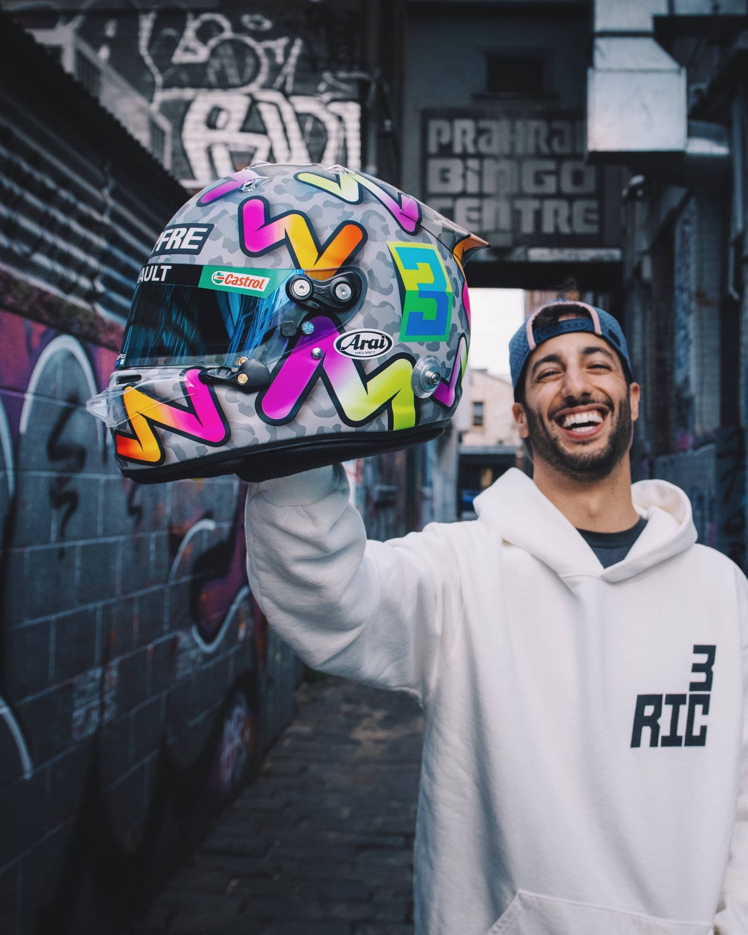 Daniel Ricciardo In White Hoodie Background