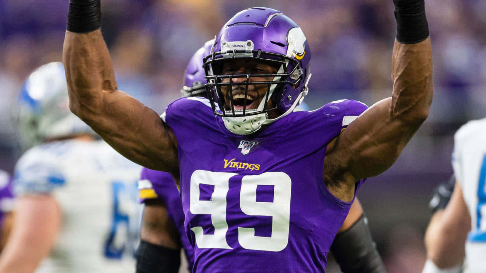 Danielle Hunter Celebrating Win Against Detroit Lions Background