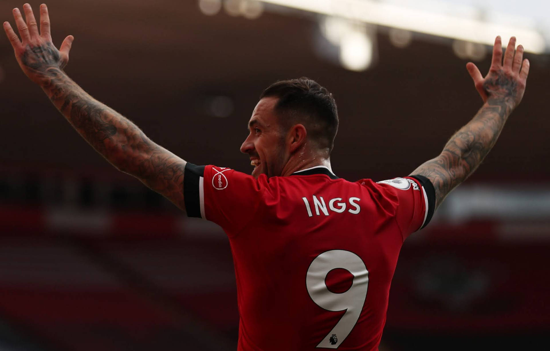 Danny Ings Arms Up Background