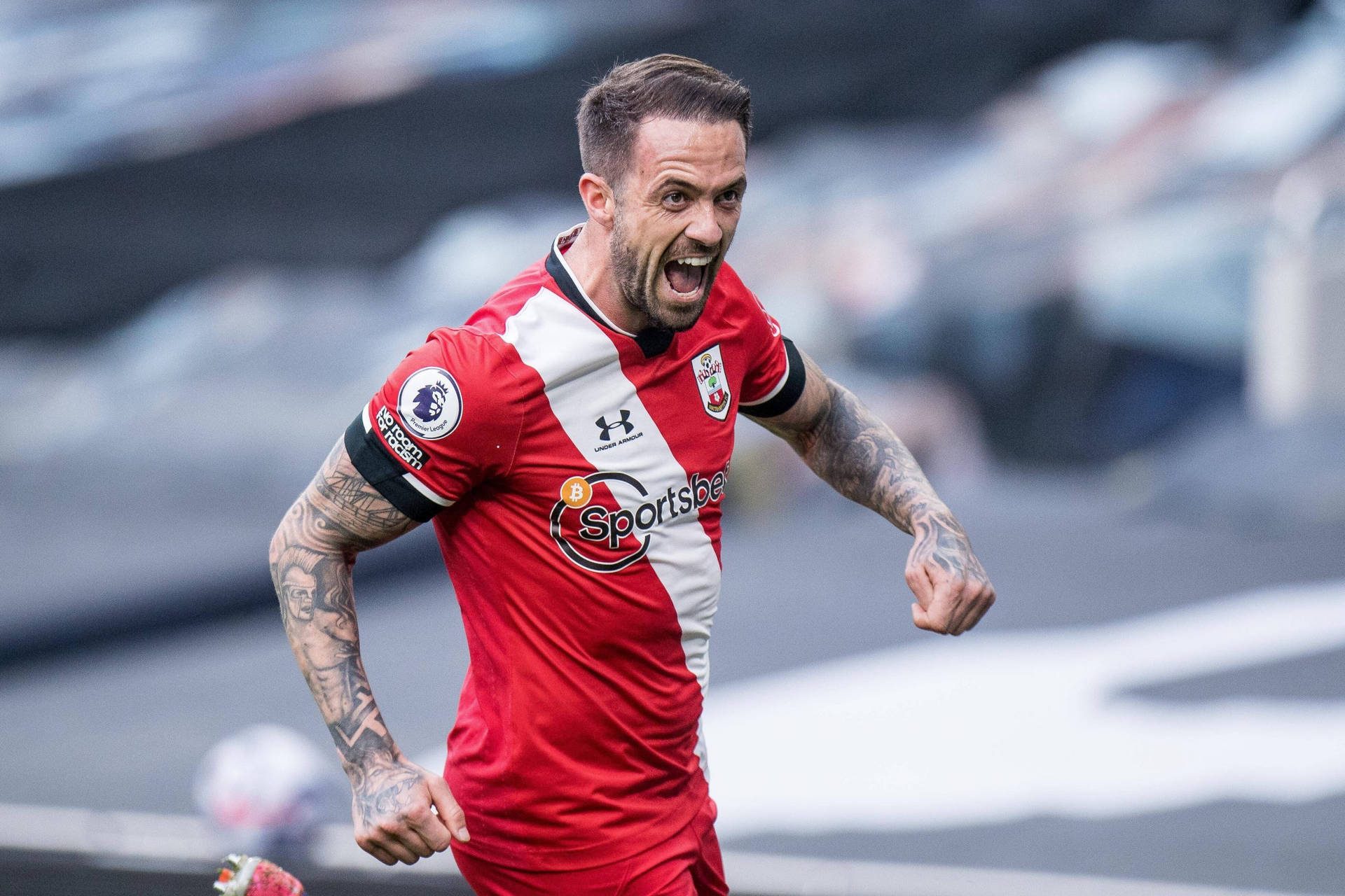 Danny Ings Yells On Field Background