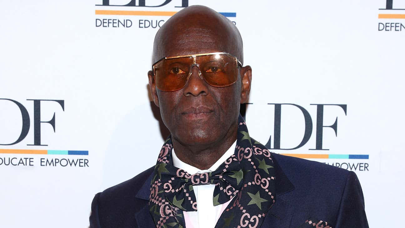 Dapper Dan Wearing Gucci Bow Tie Background