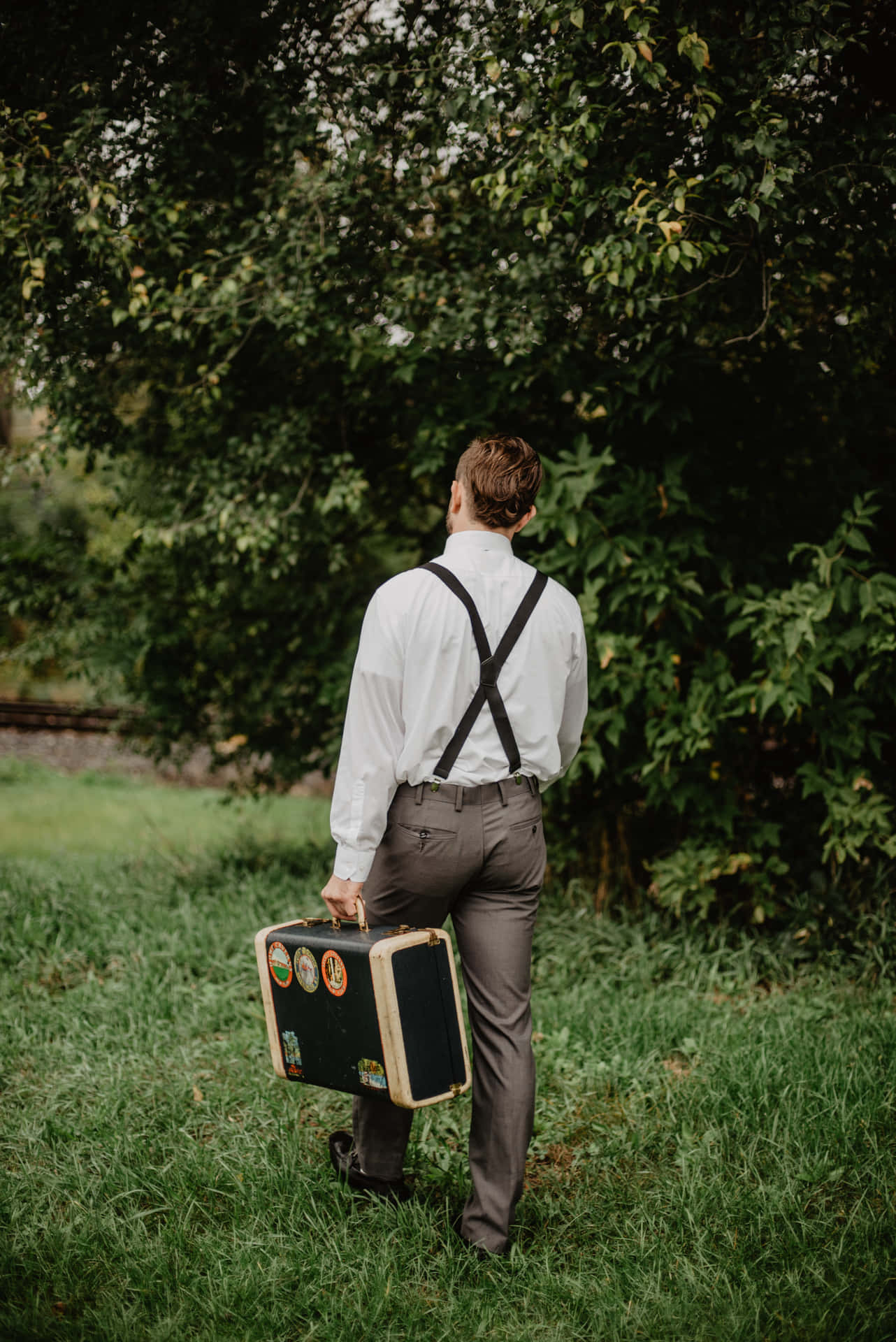 Dapper Look With Suspenders Background