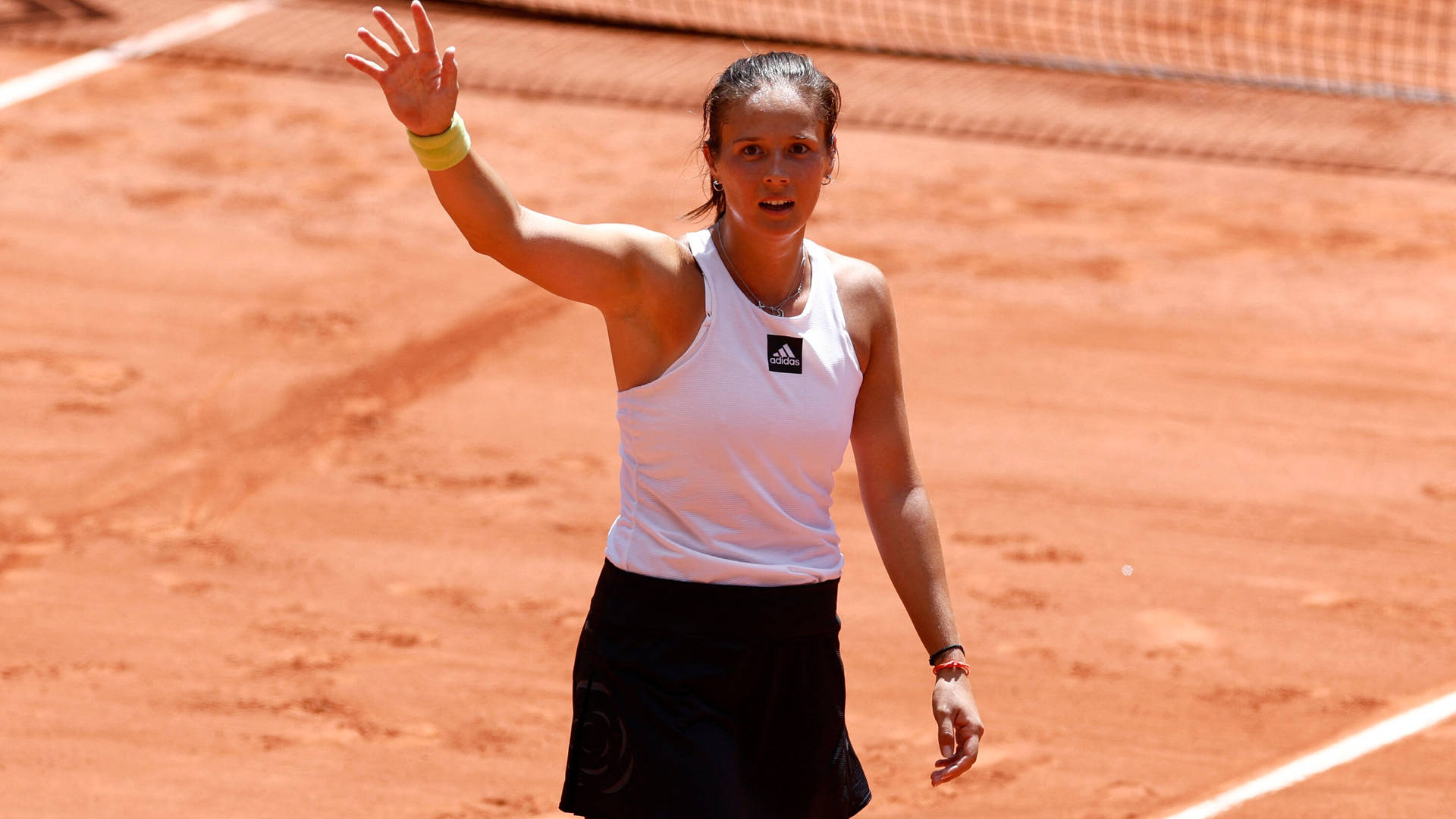 Daria Kasatkina Celebrates Victory On Tennis Court Background