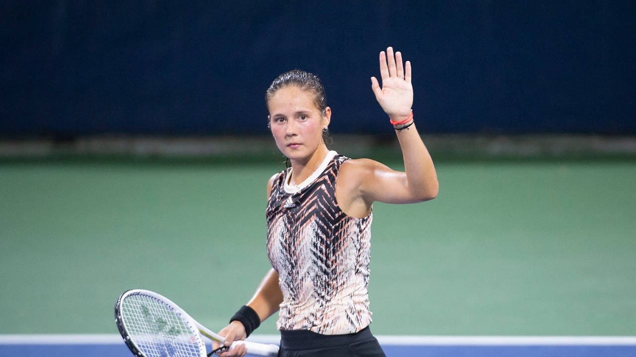 Daria Kasatkina Raises Hand To Crowd Background