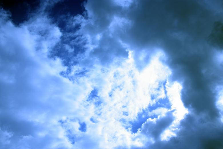 Dark Blue Clouds And Sun Rays Background