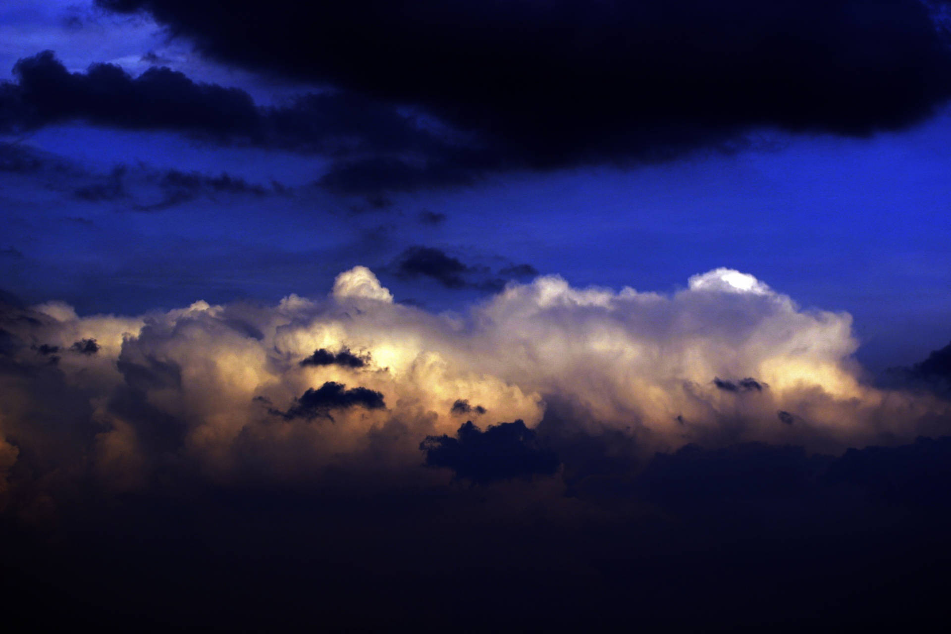 Dark Blue Clouds At Sunset Background