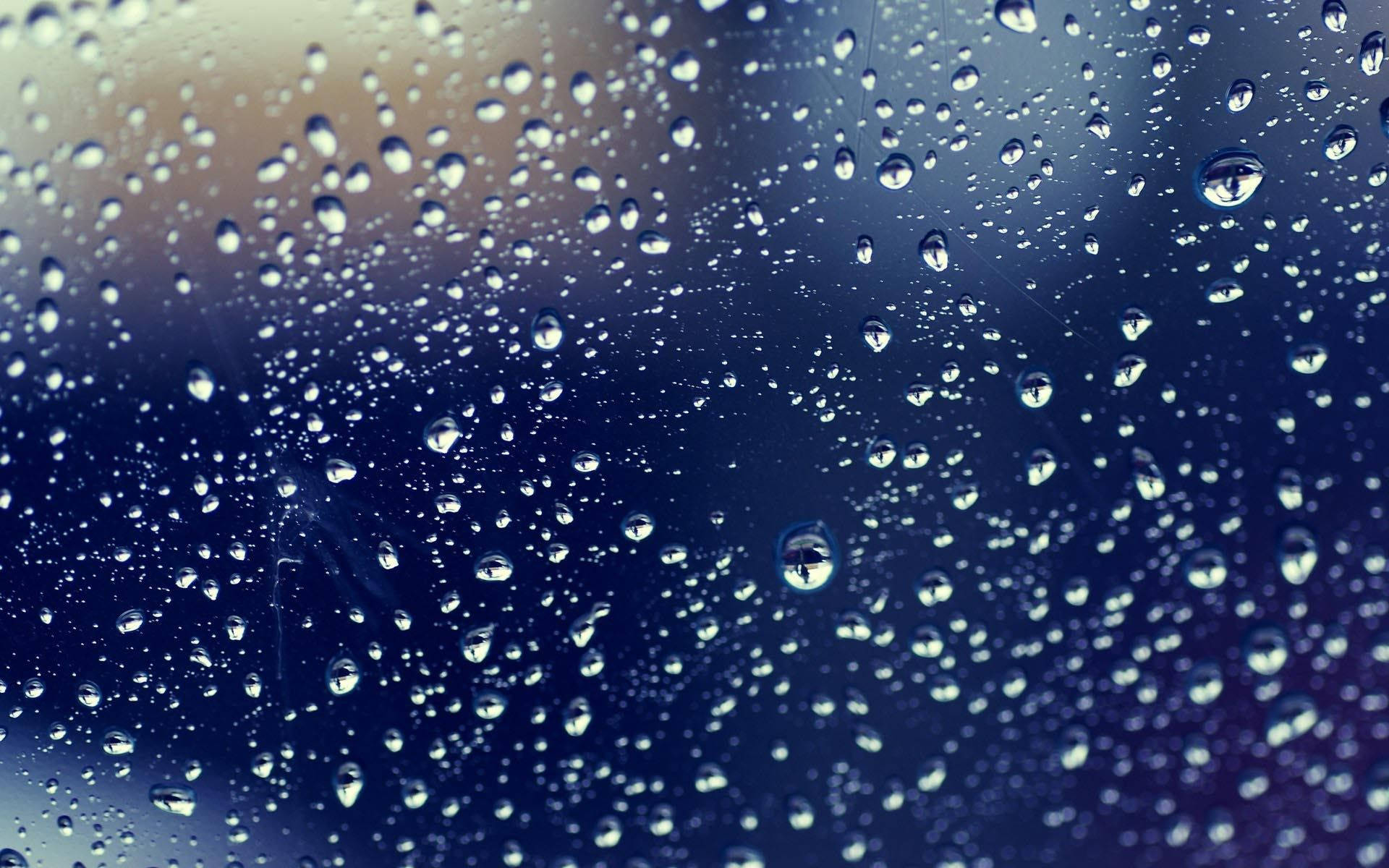 Dark Blue Glass Surface Raindrops Background