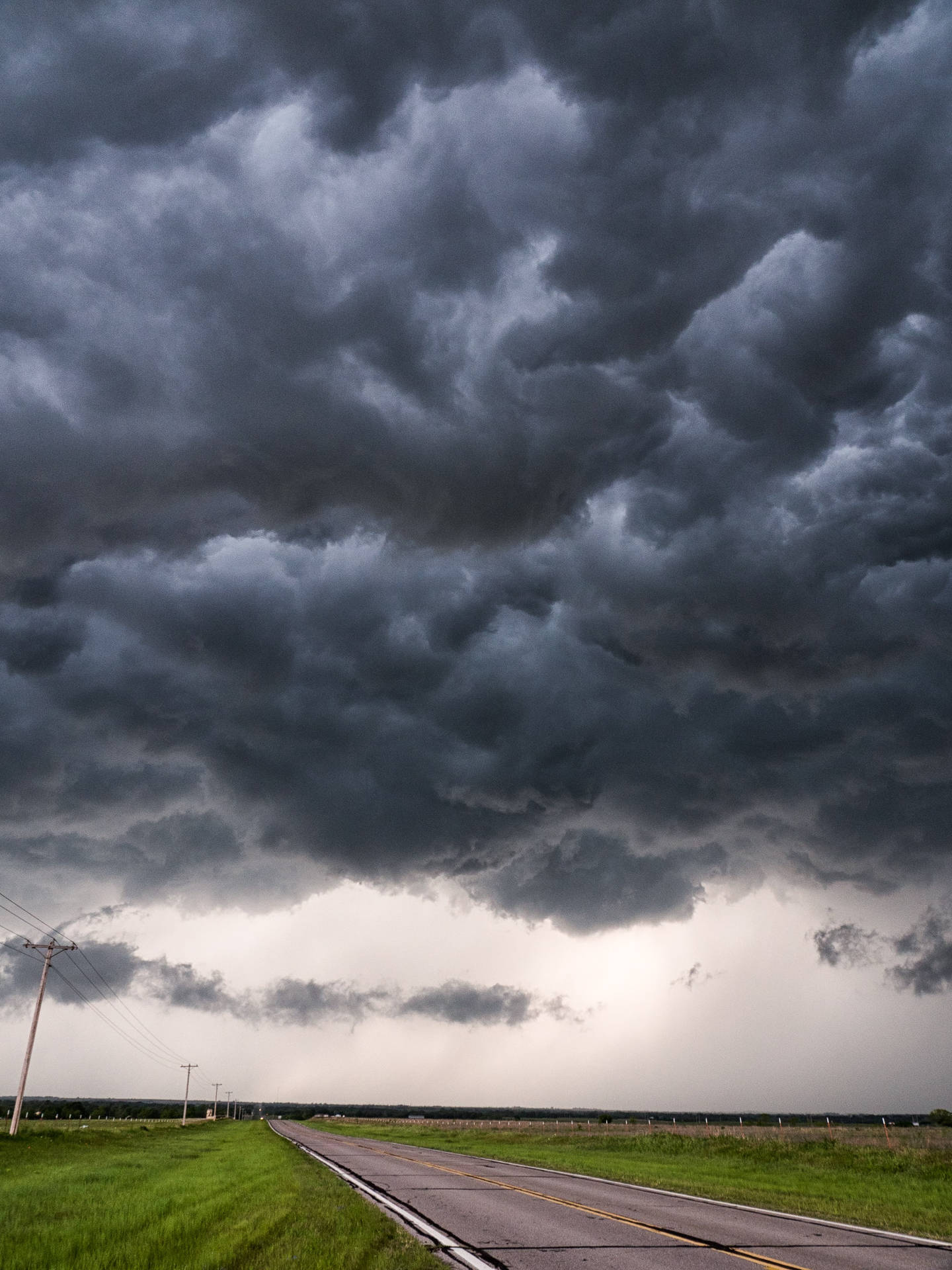 Dark Cloudy Sky Looming Storm Over Road Background