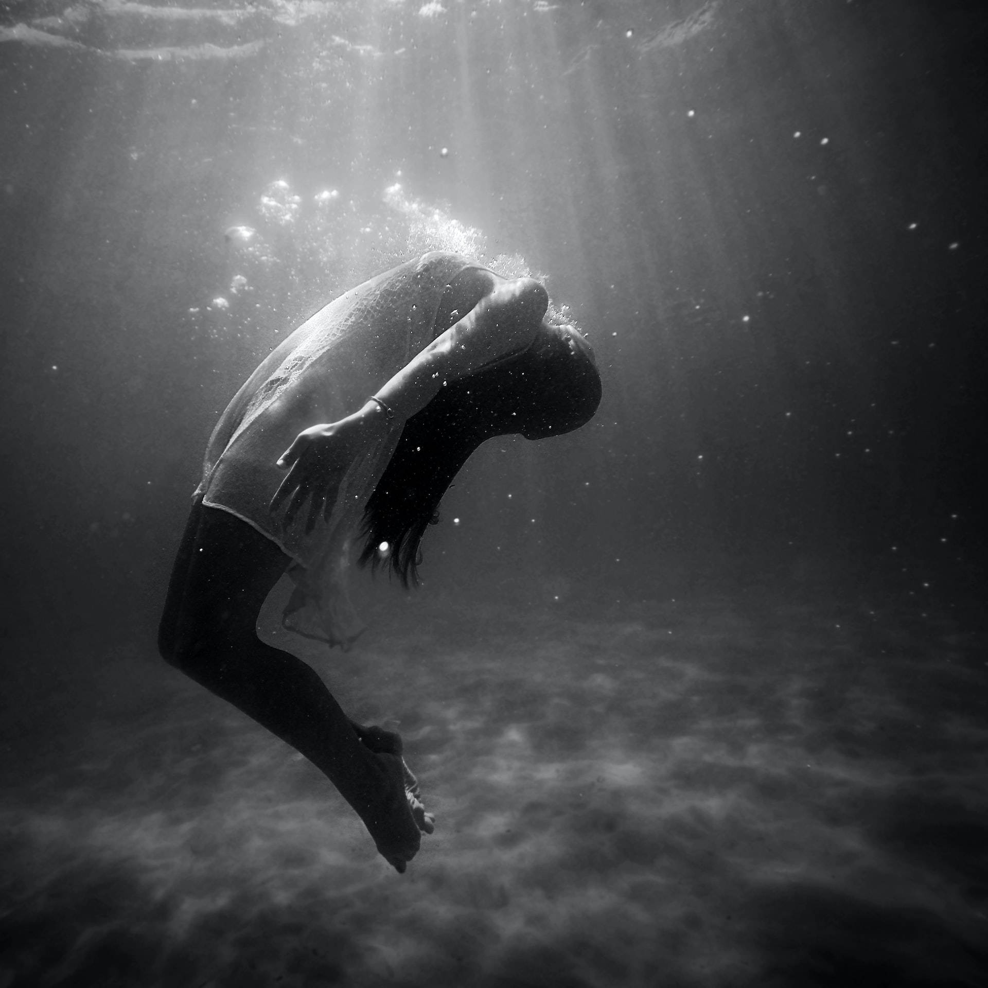 Dark Girl Floating In Waters Background