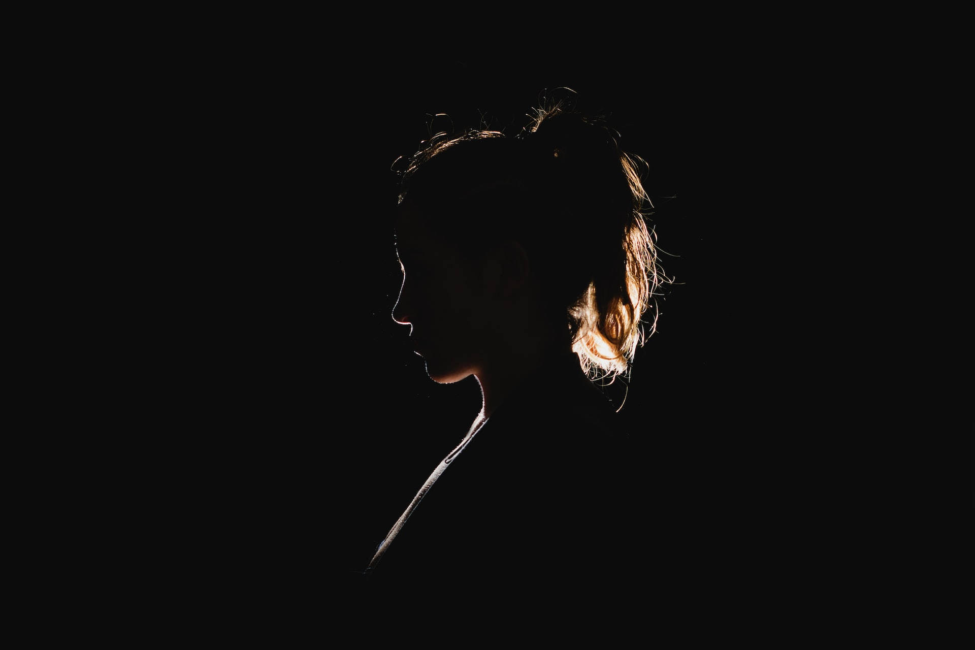 Dark Girl Side-profile Light Background