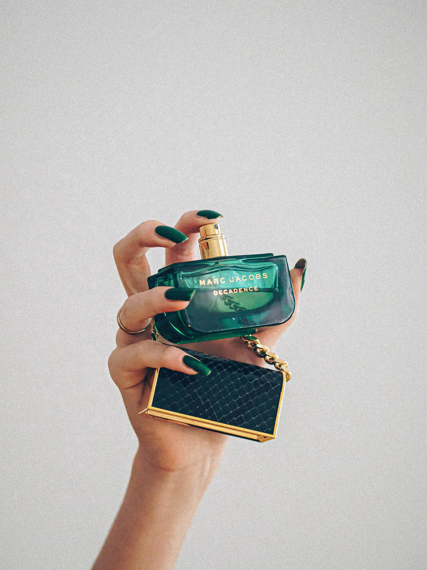 Dark Green Perfume In Hand