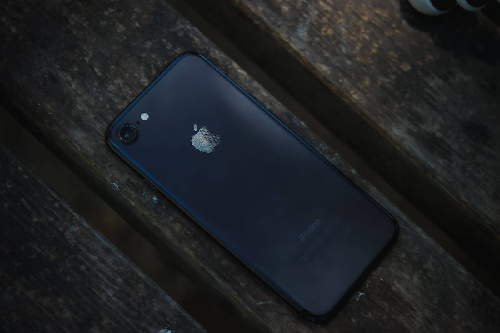 Dark Iphone 7 On Wood Background