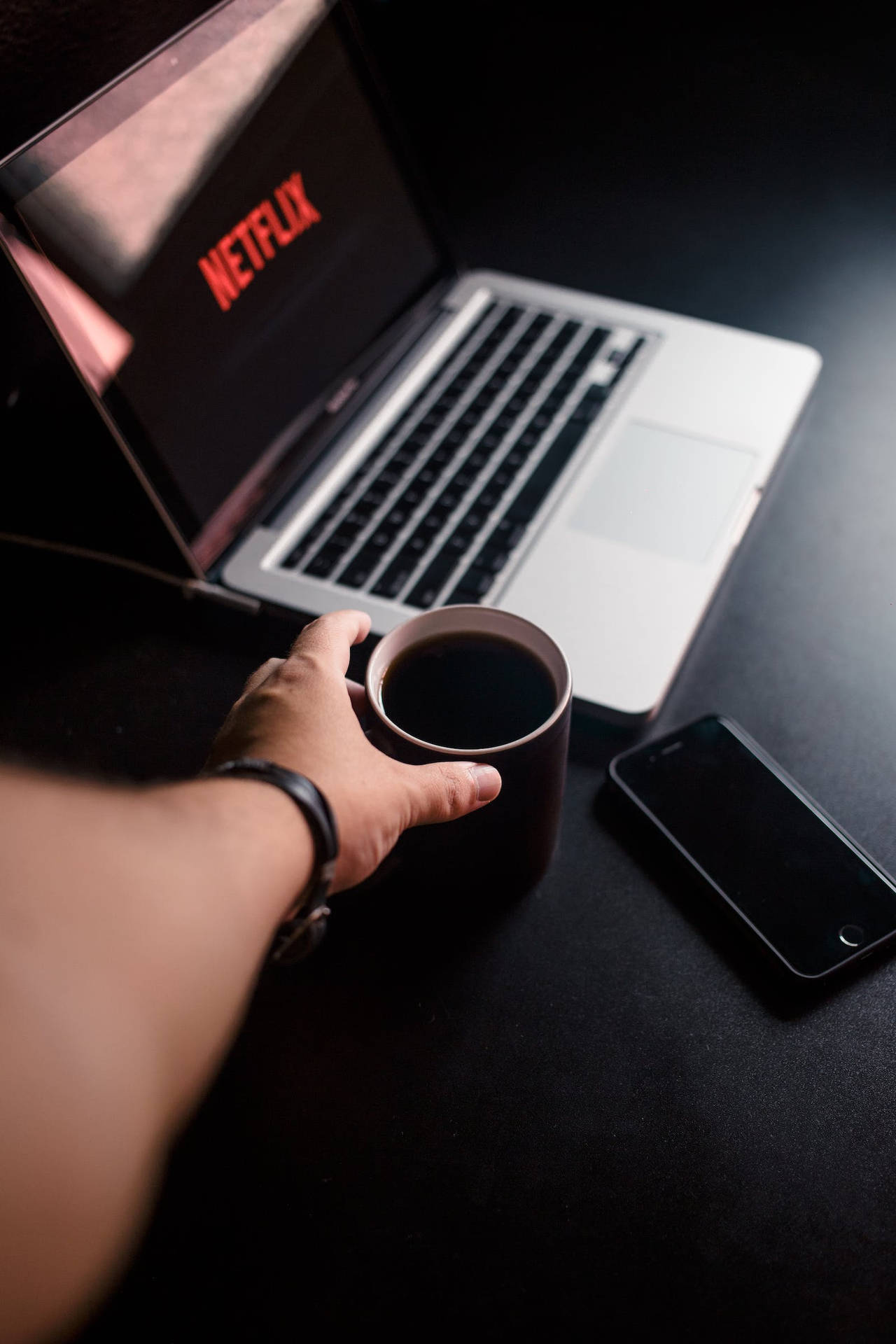 Dark Iphone With Macbook And Mug Background