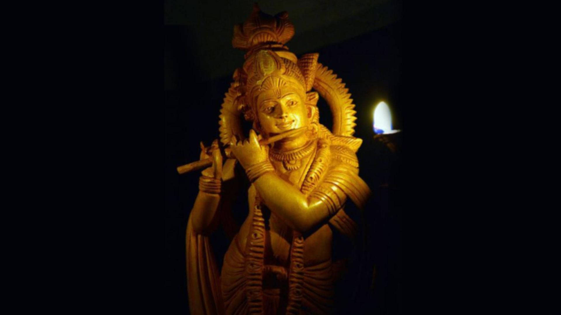 Dark Krishna Golden Statue Background