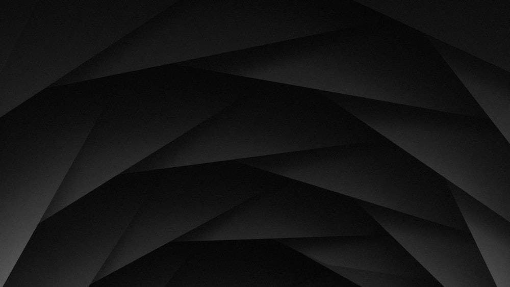 Dark Laptop Polygon Shapes Background