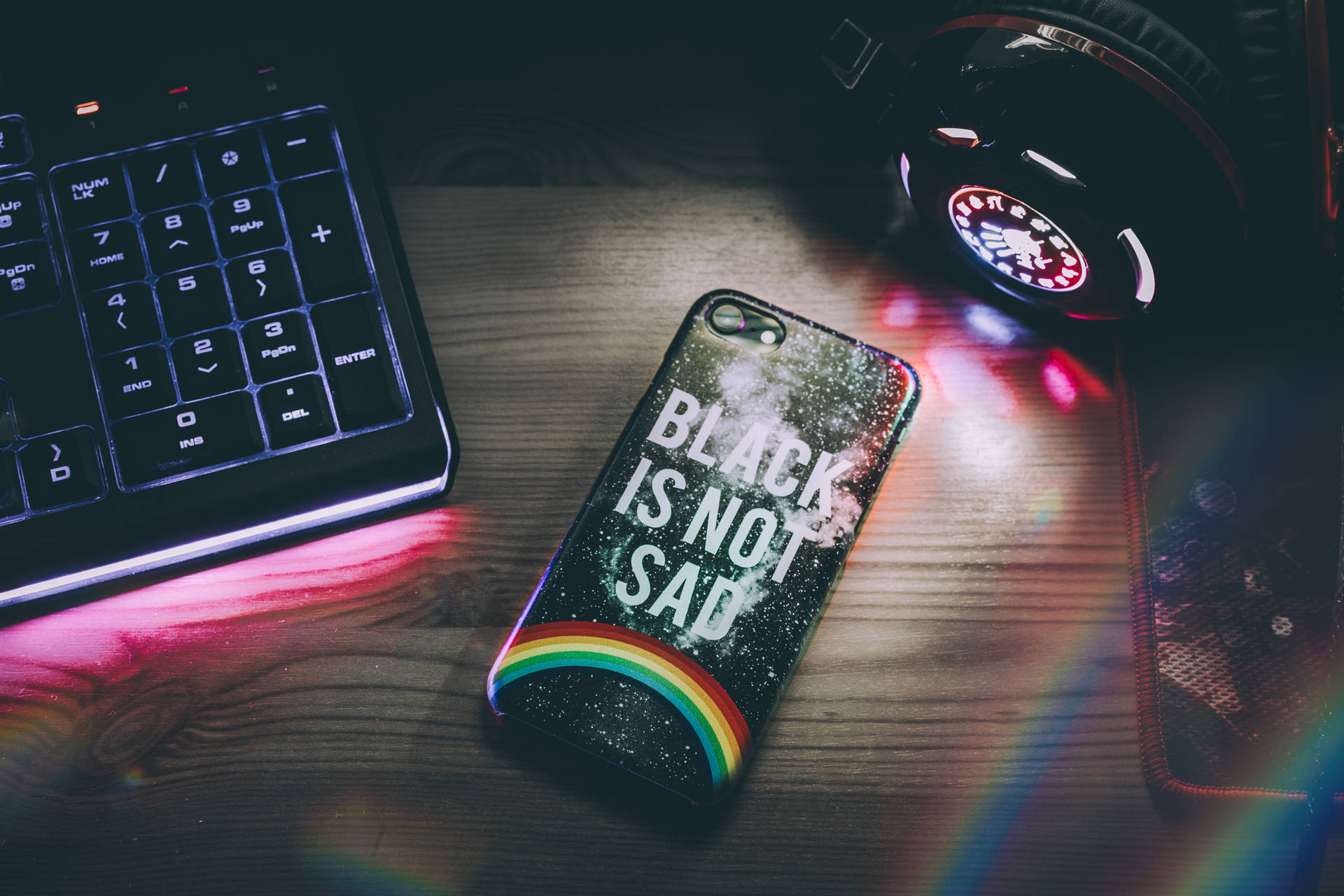 Dark Neon Iphone Beside Keyboard Background