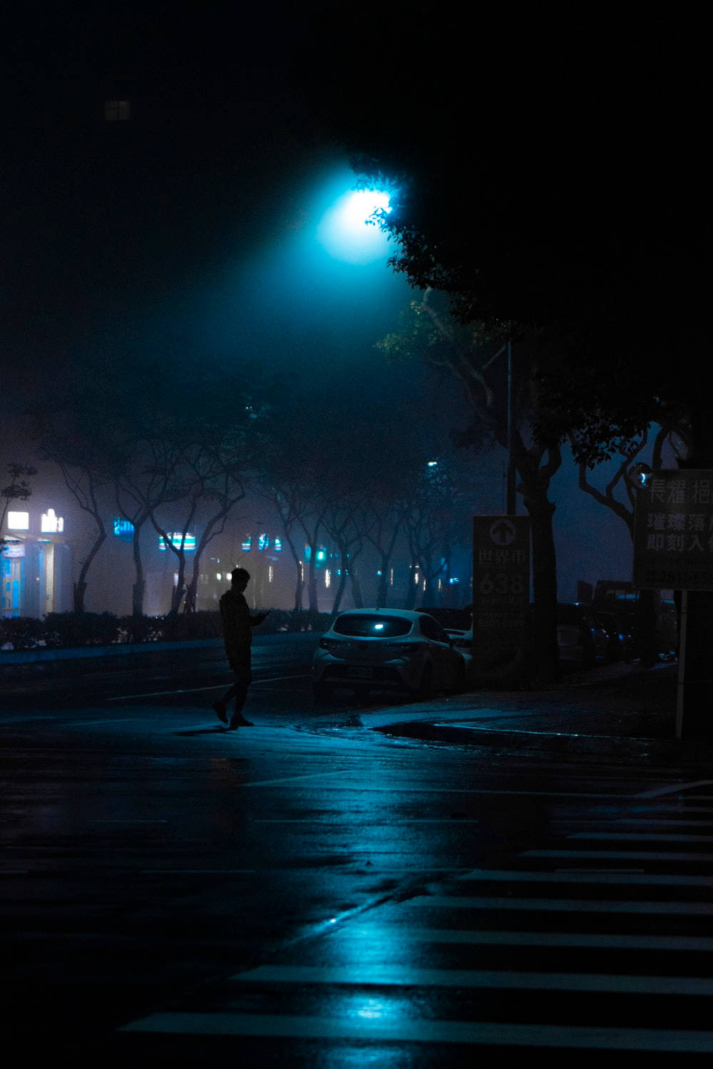 Dark Night Man Crossing Street Background
