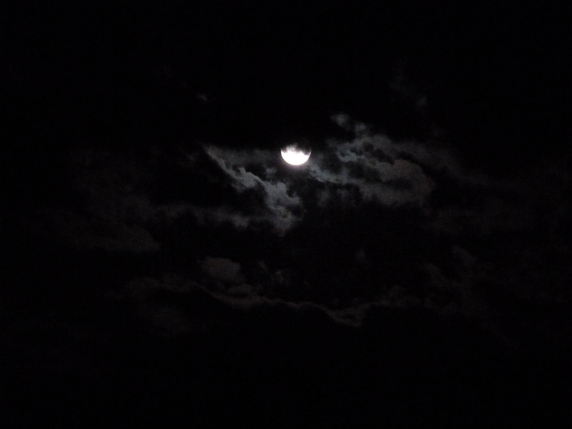 Dark Night Moon Hiding In Clouds