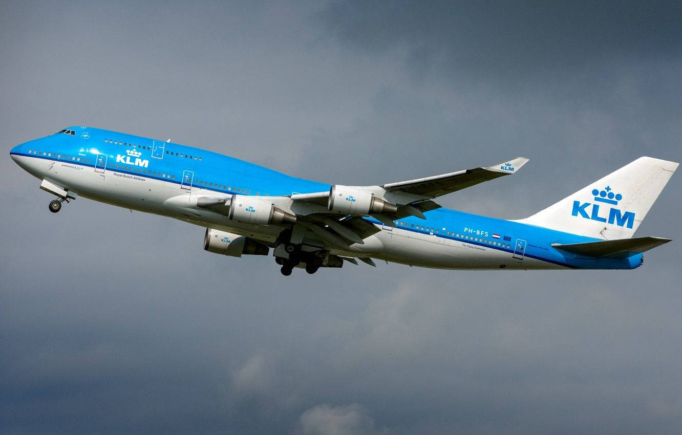 Dark Sky Over Klm Passenger Airplane Background