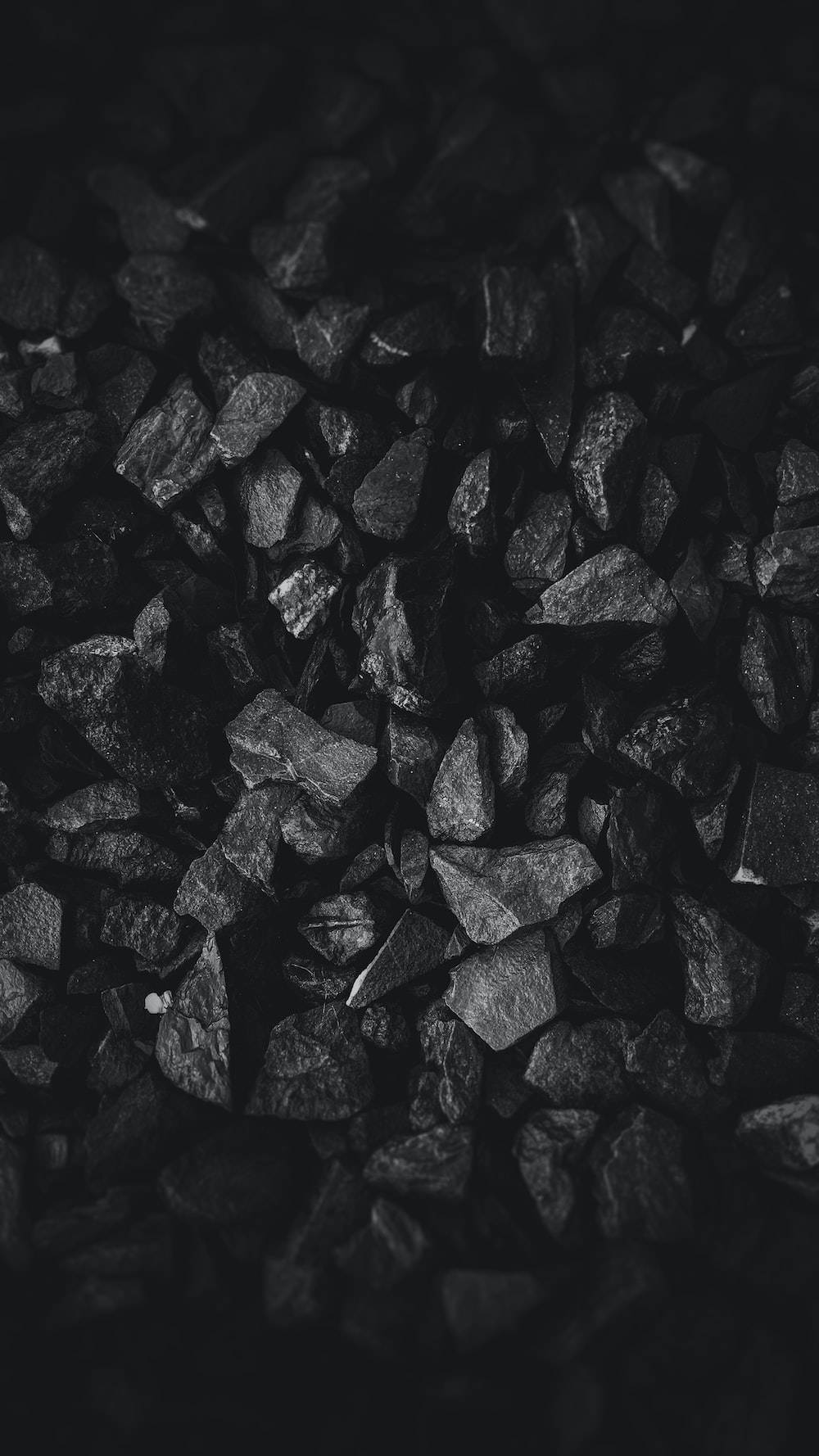 Dark Theme Pile Of Charcoal Background