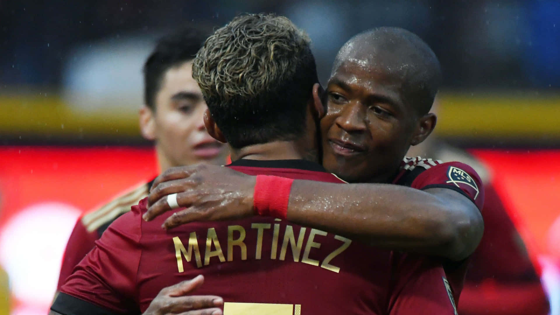 Darlington Nagbe Josef Martinez Hug Background