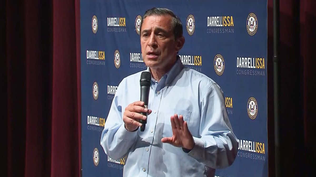 Darrell Issa Holding Microphone