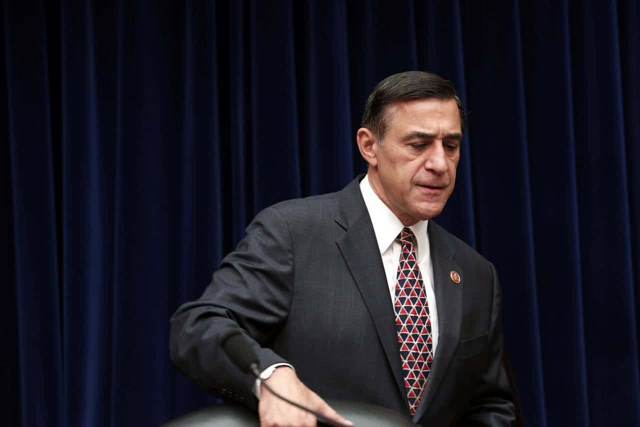 Darrell Issa With Hand On Chair
