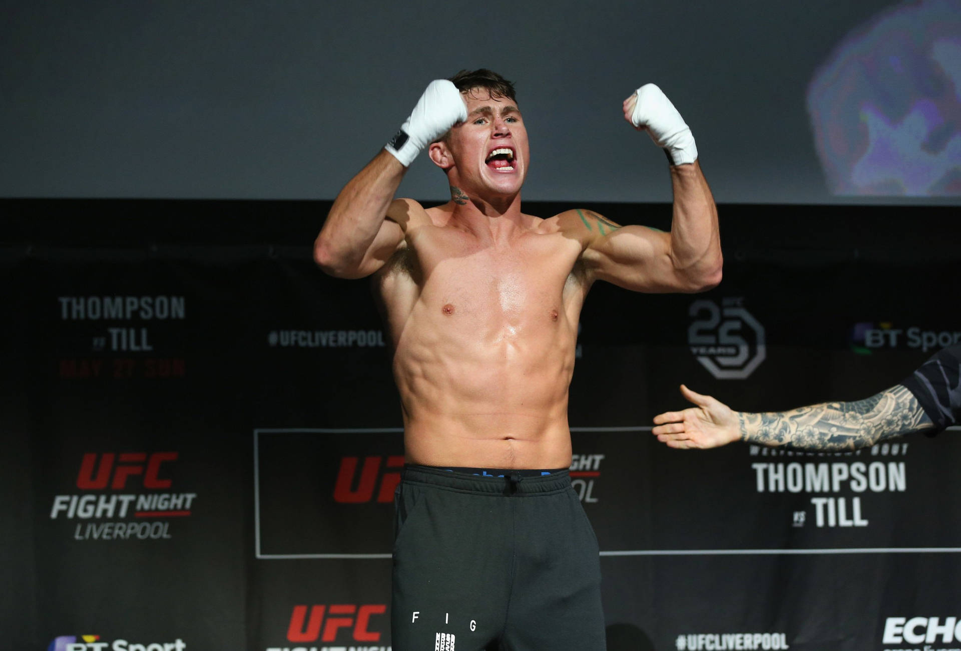 Darren Till Showing Off Gloves Background