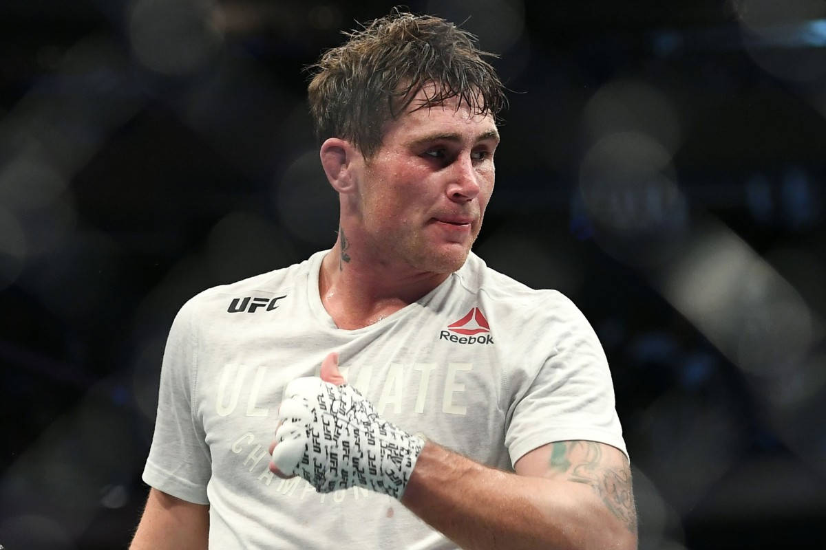 Darren Till With Signed Gloves Background