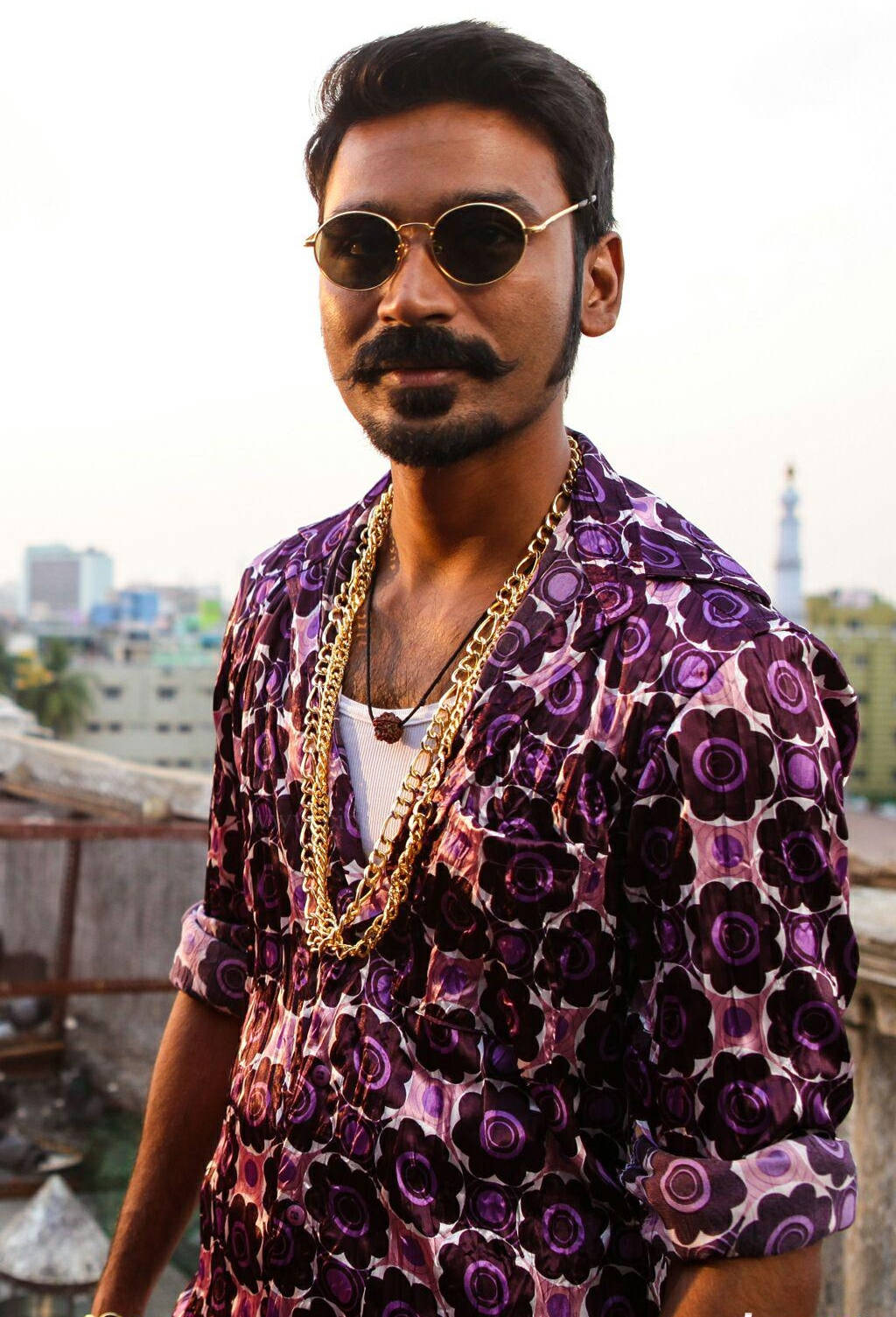 Dashing Dhanush With Gold Chain Background