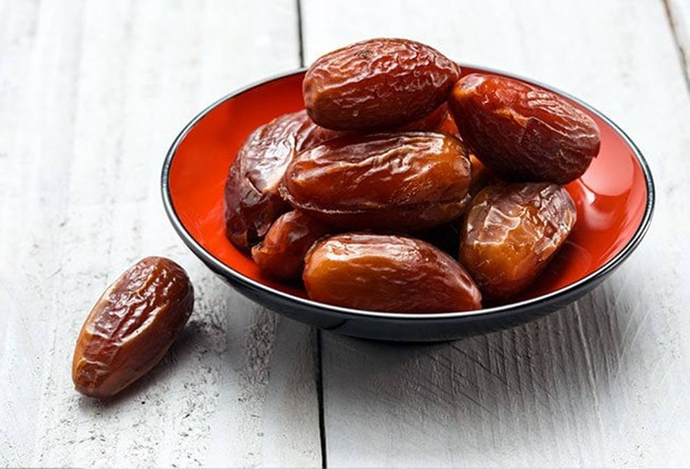 Dates On A Mini Red Bowl Background