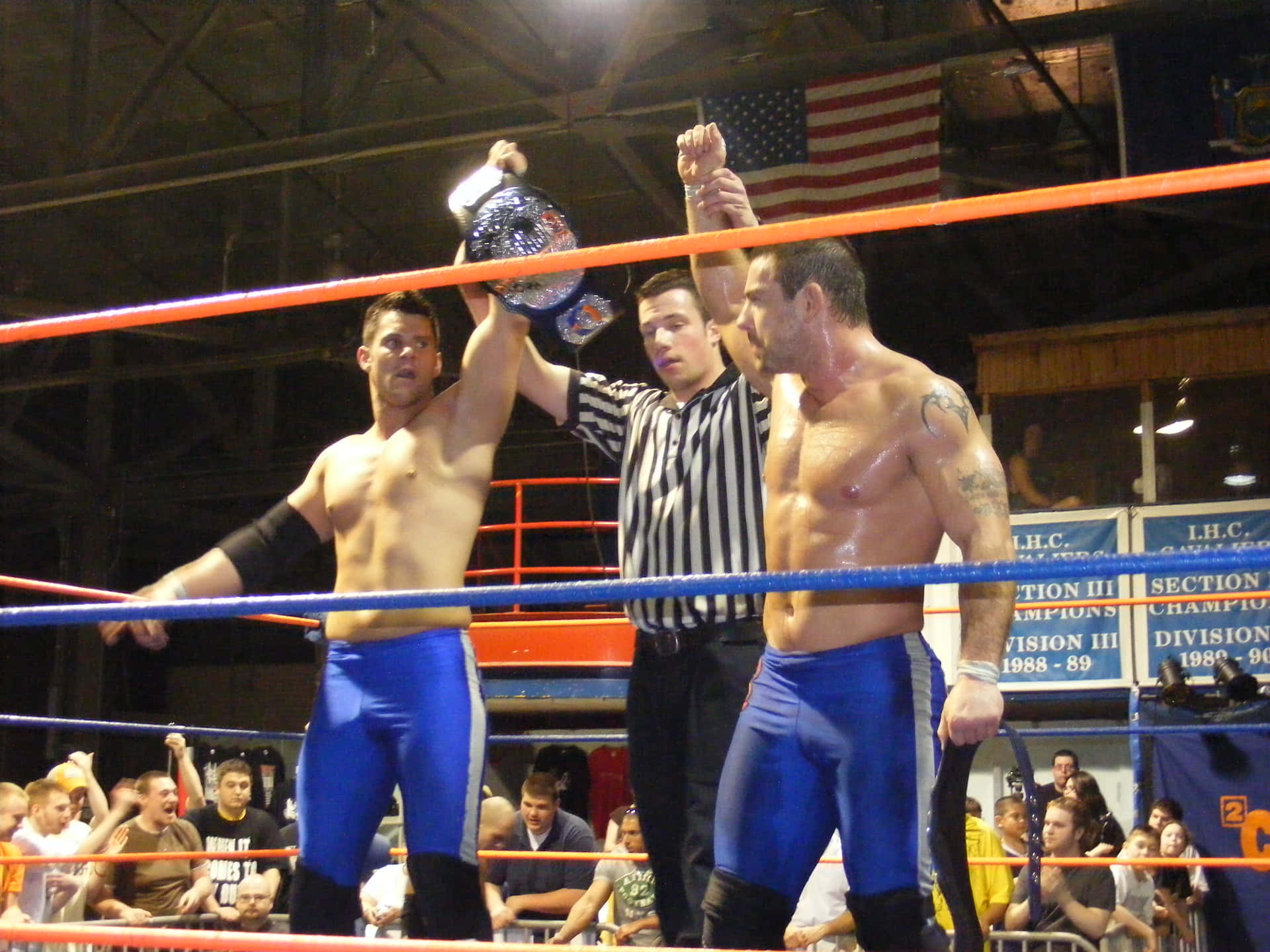 Davey Richards Holding The 2cw Tag Team Champion Belt Background