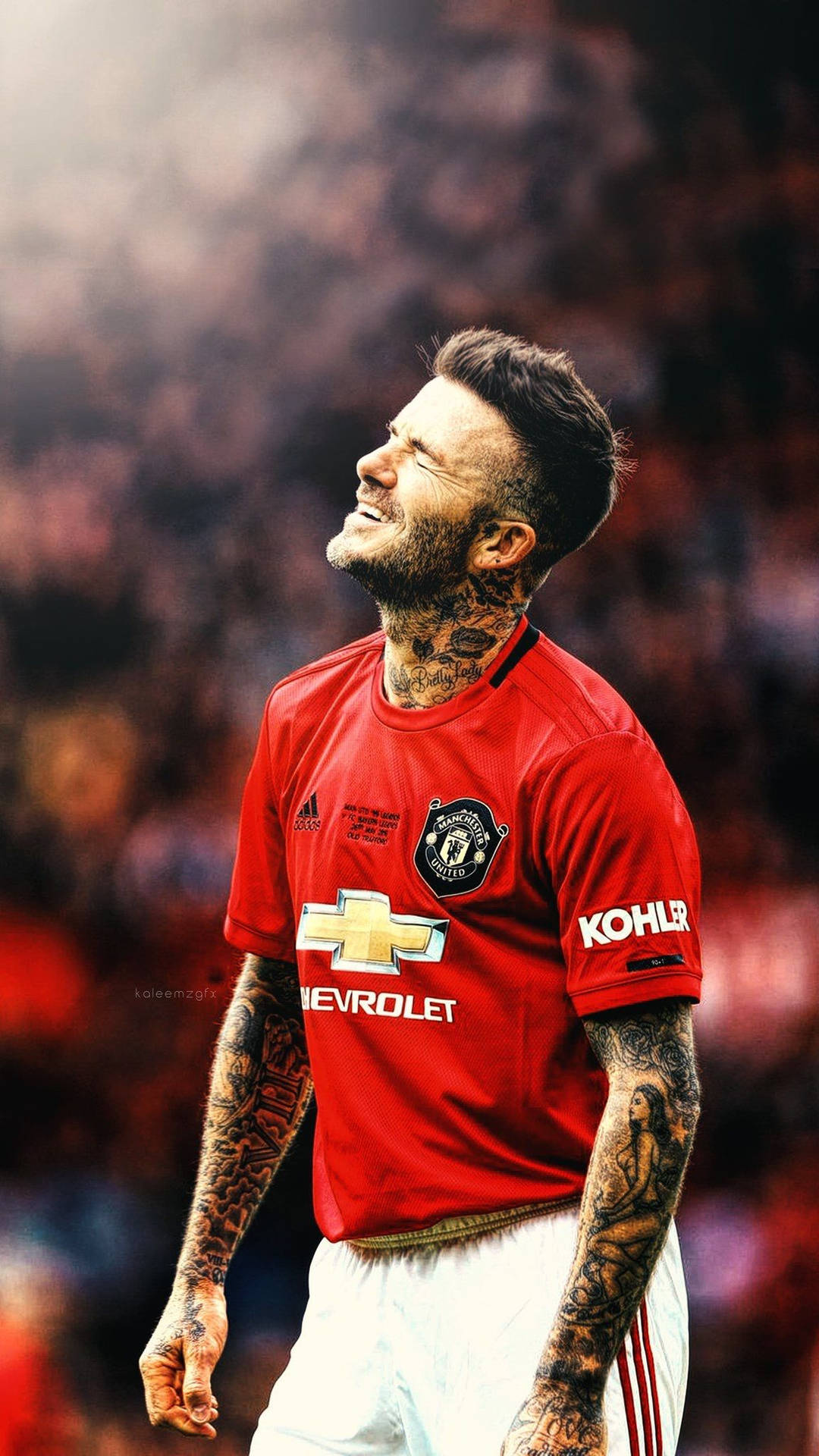 David Beckham During A Match In Old Trafford While Playing For Manchester United Background