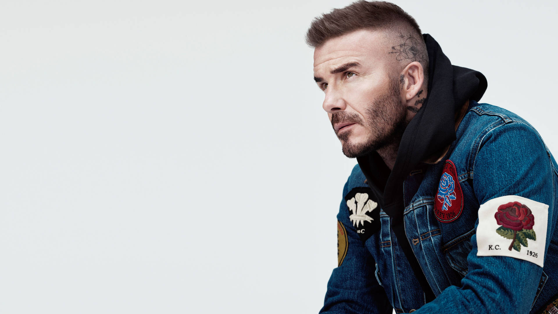 David Beckham Looking Stylish In A Kent & Curwen Suit And Glasses Background