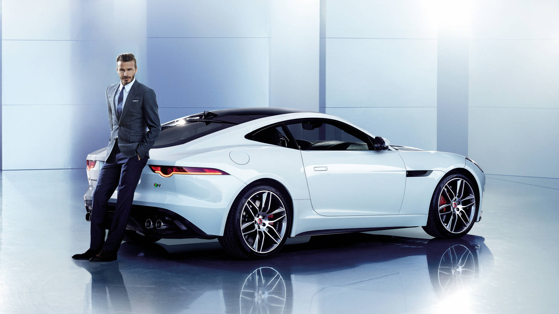 David Beckham Poses With A Sleek Jaguar Background