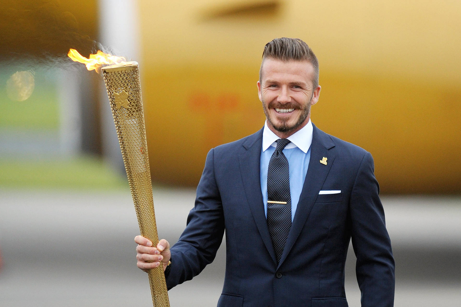 David Beckham Waves The Flag For Great Britain At The 2012 London Olympics Background