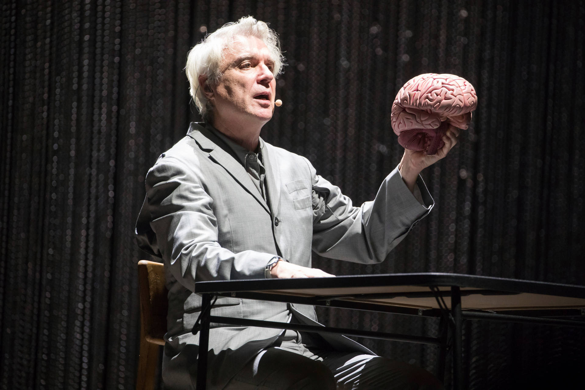 David Byrne American Utopia Holding Brain Photo Background