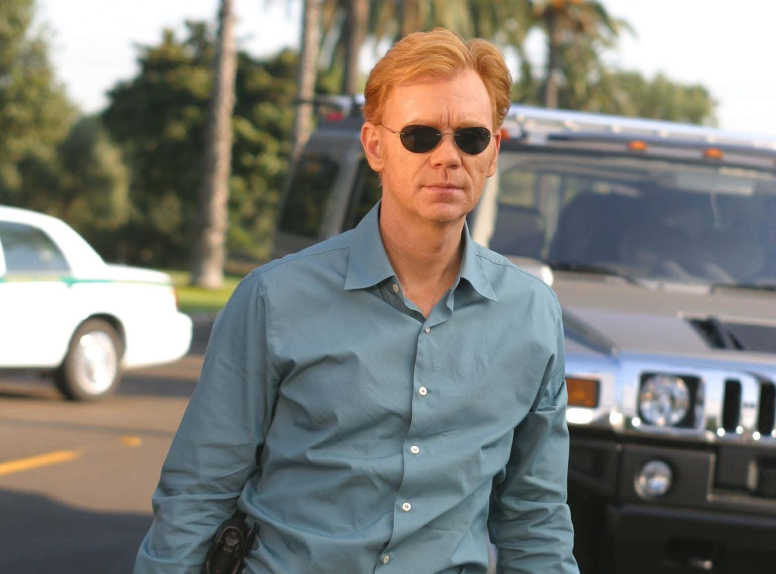 David Caruso Striking A Pose In A Black Turtleneck Sweater Background