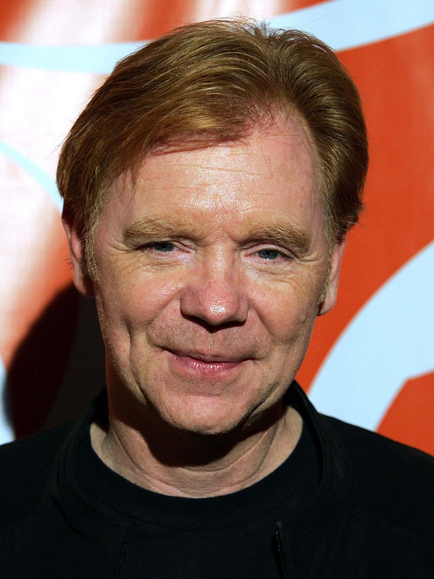 David Caruso Striking A Pose In A Photoshoot Background