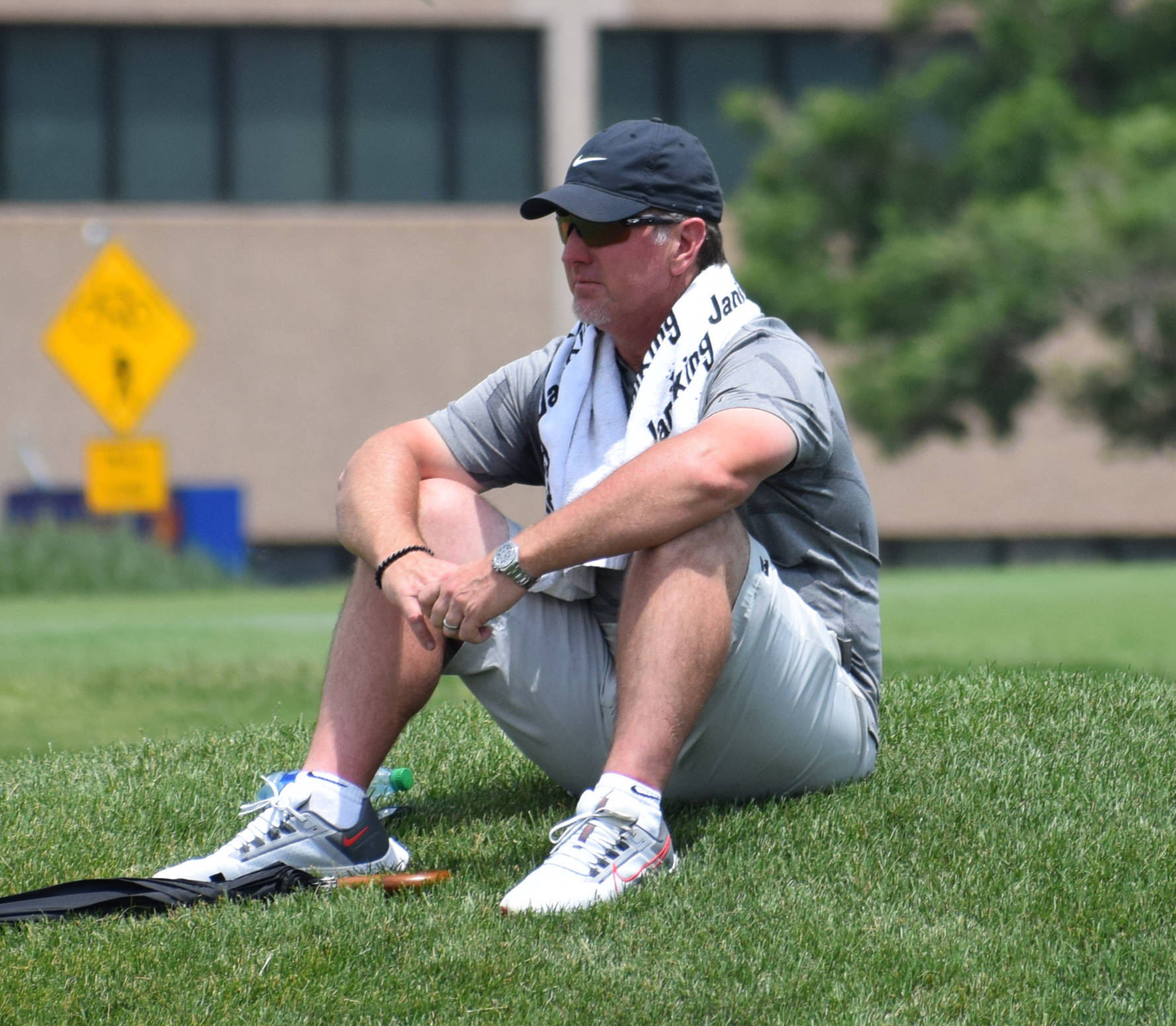 David Duval Resting On Golf Course Background