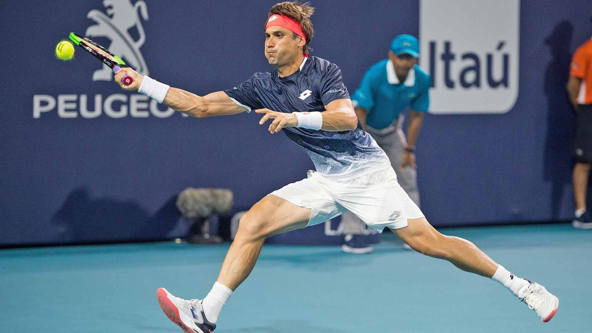 David Ferrer In Action On The Tennis Court Background