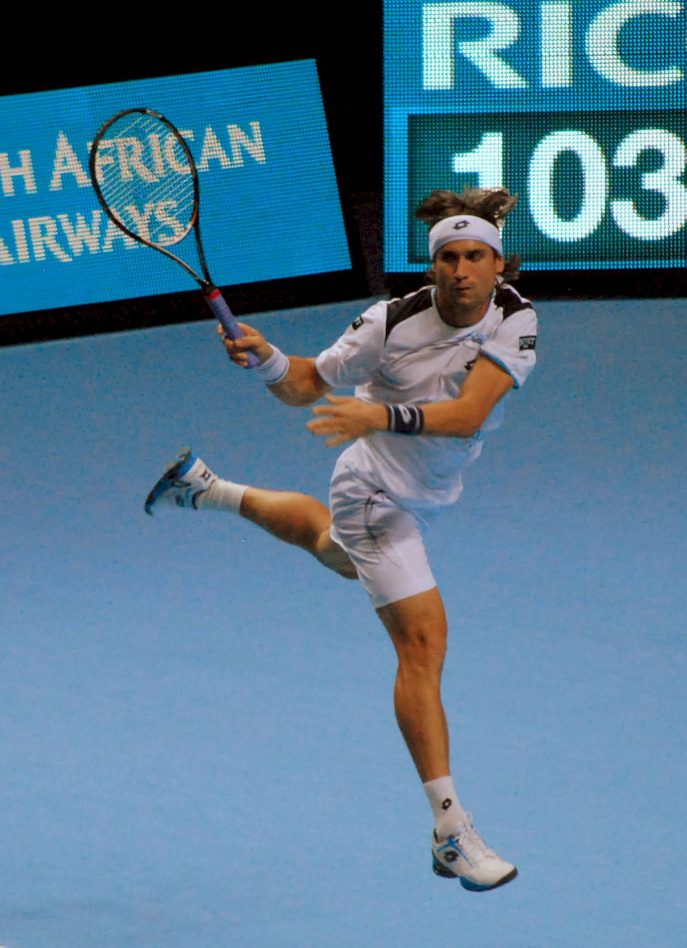 David Ferrer In Action On The Tennis Court. Background