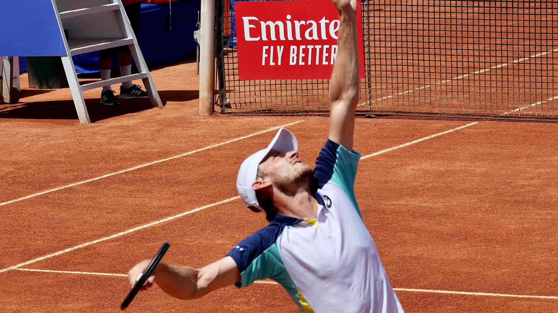 David Goffin Demonstrating A Powerful Serve In Action Background