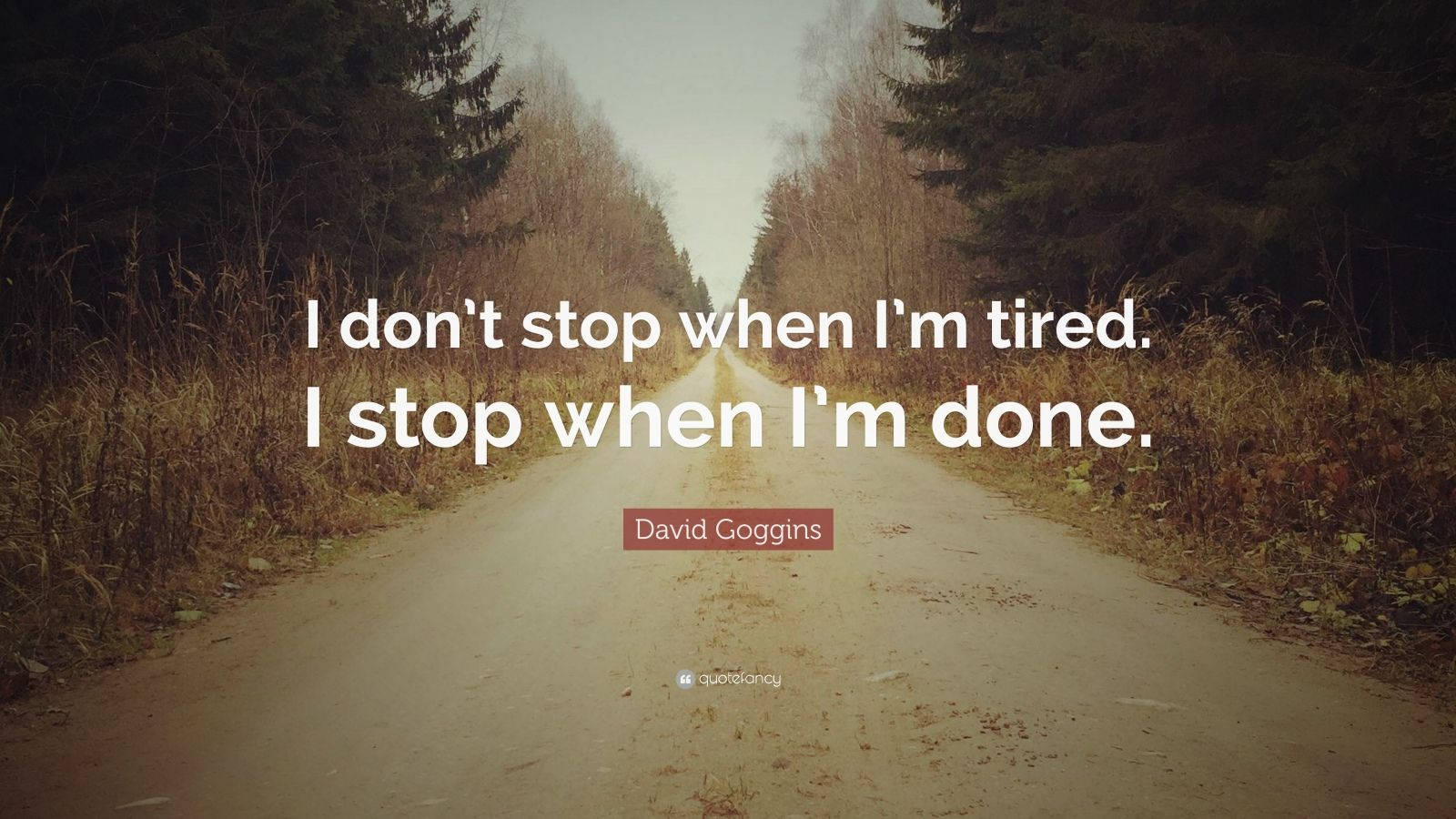 David Goggins Quote On Empty Road Background