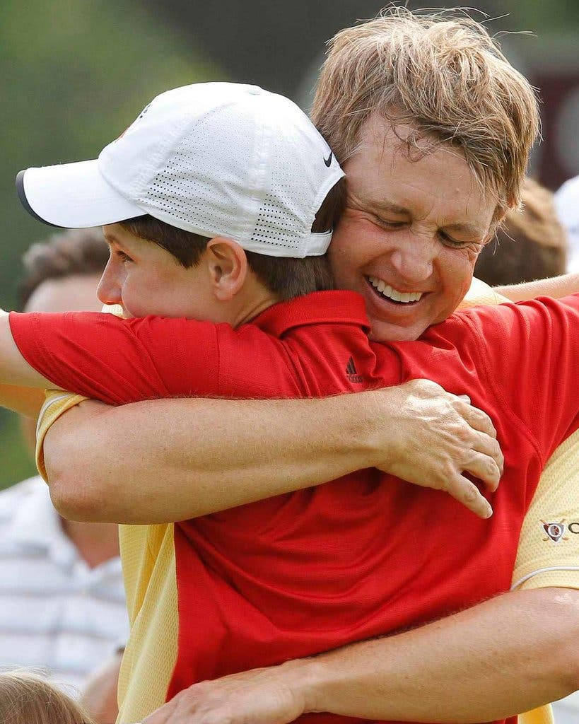 David Toms Hugging Son Background